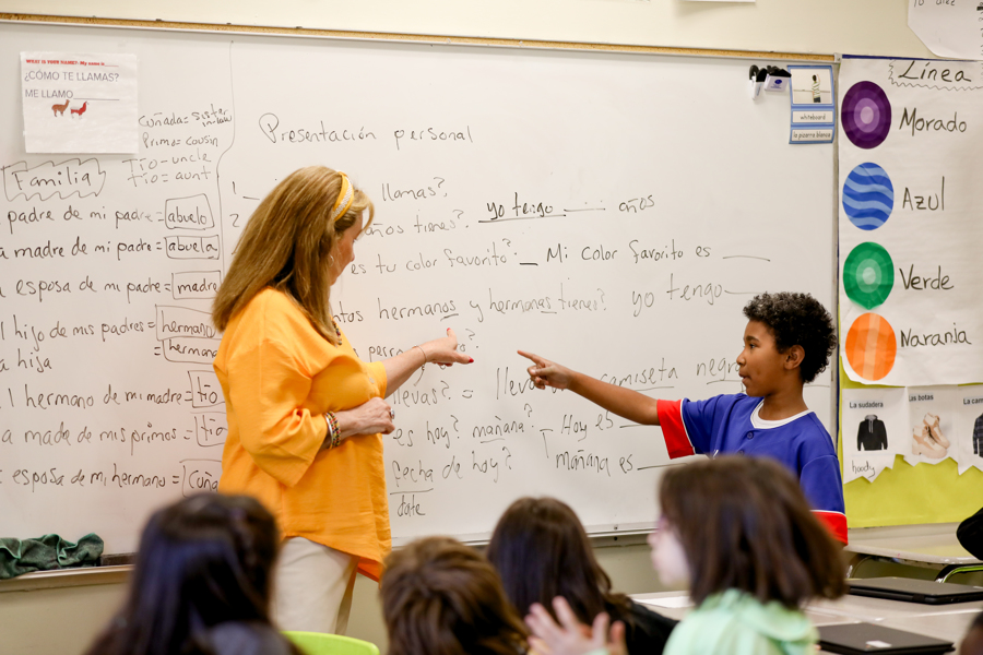 teacher and student at classroom board